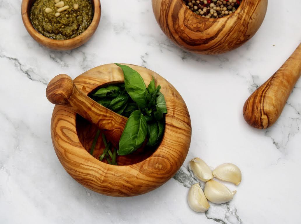 Handmade olive wood mortar and pestle with rustic Mediterranean grain, perfect for grinding spices, herbs, and nuts