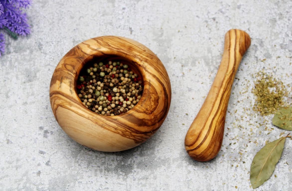 Handmade olive wood mortar and pestle with rustic Mediterranean grain, perfect for grinding spices, herbs, and nuts