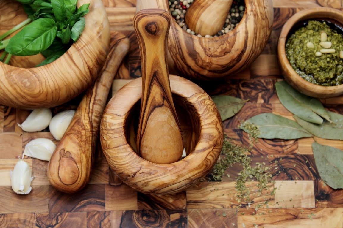 Handmade olive wood mortar and pestle with rustic Mediterranean grain, perfect for grinding spices, herbs, and nuts