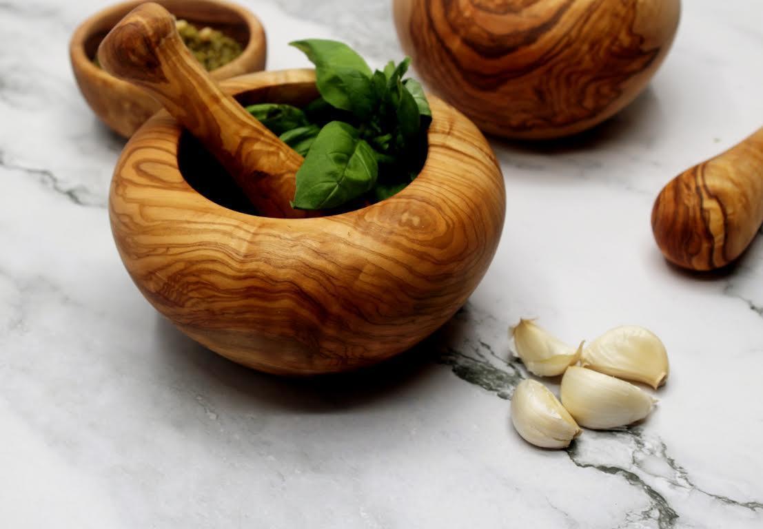 Handmade olive wood mortar and pestle with rustic Mediterranean grain, perfect for grinding spices, herbs, and nuts